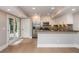 Modern kitchen with stainless steel appliances and a breakfast bar, perfect for casual dining at 1282 Kendrick Ne Rd, Brookhaven, GA 30319