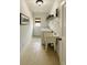 Functional laundry room equipped with a utility sink, washer, dryer, and convenient storage shelves at 1282 Kendrick Ne Rd, Brookhaven, GA 30319