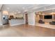 Open-concept living area with a kitchen and built in entertainment center at 1282 Kendrick Ne Rd, Brookhaven, GA 30319