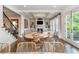 Open concept living area featuring coffered ceilings, fireplace, built-ins, and access to an outdoor patio at 1282 Kendrick Ne Rd, Brookhaven, GA 30319