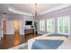 Spacious main bedroom featuring hardwood floors, tray ceiling, and ample natural light at 1282 Kendrick Ne Rd, Brookhaven, GA 30319