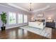 Spacious main bedroom with tray ceiling, plantation shutters and hardwood floors at 1282 Kendrick Ne Rd, Brookhaven, GA 30319