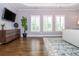 Well lit main bedroom features a mounted television, and three shuttered windows at 1282 Kendrick Ne Rd, Brookhaven, GA 30319