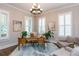 Bright home office featuring plantation shutters, a wooden desk, and comfortable seating at 1282 Kendrick Ne Rd, Brookhaven, GA 30319