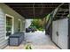 Covered patio with outdoor seating, stairs to yard, and backyard storage shed at 1282 Kendrick Ne Rd, Brookhaven, GA 30319