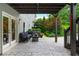 Relaxing covered patio with outdoor seating and lush landscaping for privacy at 1282 Kendrick Ne Rd, Brookhaven, GA 30319