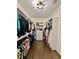 Spacious walk-in closet with custom shelving and ample storage for clothes and shoes at 1282 Kendrick Ne Rd, Brookhaven, GA 30319