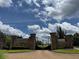 Ornate wrought iron gates at the brick entrance to a luxurious community at 4309 Giverney Blvd, Fairburn, GA 30213