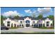 Stunning exterior elevation of a luxury home showcasing architectural details and a large driveway at 4309 Giverney Blvd, Fairburn, GA 30213