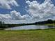 Scenic view of a tranquil lake surrounded by lush greenery and blue skies at 4309 Giverney Blvd, Fairburn, GA 30213