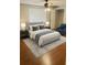 Bedroom with large bed, hardwood floors, and natural light at 5581 Marbut Rd, Lithonia, GA 30058