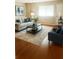 Bright living room featuring a comfortable sofa, chair, and stylish decor at 5581 Marbut Rd, Lithonia, GA 30058