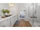 Bright bathroom features a double sink vanity, glass shower, and modern finishes at 1313 Pj East Rd, Covington, GA 30014
