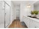 Bathroom with dual vanity, white cabinets, and a glass-enclosed shower at 1313 Pj East Rd, Covington, GA 30014