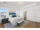 Bedroom featuring a tray ceiling, natural light, and en suite bathroom at 1313 Pj East Rd, Covington, GA 30014