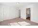 Neutral bedroom featuring carpeting, white walls and trim and a door to the bathroom at 1313 Pj East Rd, Covington, GA 30014