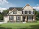Charming two-story home with neutral siding, dark shutters, and a well-manicured lawn at 1313 Pj East Rd, Covington, GA 30014