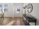 Bright foyer featuring wood floors, a console table, and views of the neighborhood at 1313 Pj East Rd, Covington, GA 30014