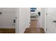Hallway with hard wood floors leading to the bedroom at 1313 Pj East Rd, Covington, GA 30014