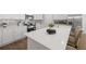 Contemporary kitchen featuring white cabinetry, stainless steel appliances, and an island with seating at 1313 Pj East Rd, Covington, GA 30014