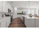 Bright, modern kitchen with white cabinets, stainless appliances, and quartz countertops at 1313 Pj East Rd, Covington, GA 30014