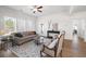 Bright living room with large windows, wood floors, and a comfortable seating area at 1313 Pj East Rd, Covington, GA 30014