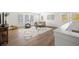 Open upstairs living room boasts natural light and neutral decor at 1313 Pj East Rd, Covington, GA 30014