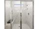 Glass shower with marble-look tile is bright and clean at 1313 Pj East Rd, Covington, GA 30014