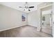 Spacious bedroom with hardwood floors, a ceiling fan, and an adjacent doorway at 190 Judy Sw Ln, Atlanta, GA 30315