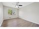 Bright bedroom with hardwood floors, a ceiling fan, and a large window for natural light at 190 Judy Sw Ln, Atlanta, GA 30315