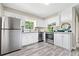 Well-lit kitchen with stainless steel appliances and white cabinets at 190 Judy Sw Ln, Atlanta, GA 30315