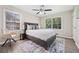 Cozy main bedroom featuring neutral tones, a ceiling fan, and natural light at 190 Judy Sw Ln, Atlanta, GA 30315