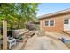 Cozy backyard patio area with outdoor seating, a coffee table, and a brick exterior at 222 Bishop Ne Dr, Marietta, GA 30060