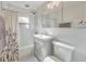 Bright bathroom features a shower and tub combination, light gray vanity, and a hexagon tile floor at 222 Bishop Ne Dr, Marietta, GA 30060