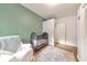 This charming Bedroom includes a crib, and sitting chair, creating a peaceful space at 222 Bishop Ne Dr, Marietta, GA 30060