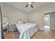 Cozy bedroom features a ceiling fan and a queen-sized bed with white linens at 222 Bishop Ne Dr, Marietta, GA 30060