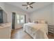 Sunlit bedroom featuring hardwood floors, neutral colors, and an adjacent bright window at 222 Bishop Ne Dr, Marietta, GA 30060
