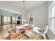Dining room adjacent to the living room and kitchen areas with hardwood floors at 222 Bishop Ne Dr, Marietta, GA 30060