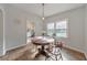 Cozy dining area with wood table, pendant lighting, and view of the updated kitchen at 222 Bishop Ne Dr, Marietta, GA 30060