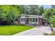 Charming single-story home with brick and siding, a welcoming front porch, and a well-maintained lawn at 222 Bishop Ne Dr, Marietta, GA 30060