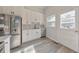 Bright kitchen featuring white cabinets, stainless steel appliances, and a subway tile backsplash at 222 Bishop Ne Dr, Marietta, GA 30060