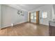 Inviting room with hardwood floors, white door with patterned glass, and lots of natural light at 222 Bishop Ne Dr, Marietta, GA 30060