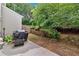 Backyard featuring a patio with a grill and a landscaped garden at 2263 Nottley Dr # 2, Marietta, GA 30066