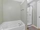 Cozy bathroom featuring a soaking tub and separate shower with glass enclosure at 2263 Nottley Dr # 2, Marietta, GA 30066