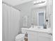 Bathroom with white vanity, toilet, mirror, and shower at 2263 Nottley Dr # 2, Marietta, GA 30066