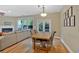 Open dining area with hardwood floors, stylish lighting, and access to the outdoor patio at 2263 Nottley Dr # 2, Marietta, GA 30066