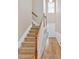 Hallway featuring hardwood floors and a staircase leading to the upper level at 2263 Nottley Dr # 2, Marietta, GA 30066