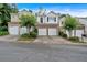 Street view of townhomes, featuring attached garages and well-maintained landscaping at 2263 Nottley Dr # 2, Marietta, GA 30066