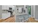 Open-concept kitchen with island, granite countertops, white cabinets, and stainless steel appliances at 2263 Nottley Dr # 2, Marietta, GA 30066