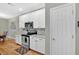 Well-lit kitchen featuring modern appliances, granite counters, and stylish backsplash at 2263 Nottley Dr # 2, Marietta, GA 30066
